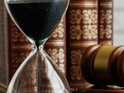 court-concept-hourglass-and-judge-gavel-on-table-C29WNTL.jpg